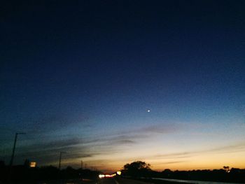 Scenic view of moon against clear sky at night