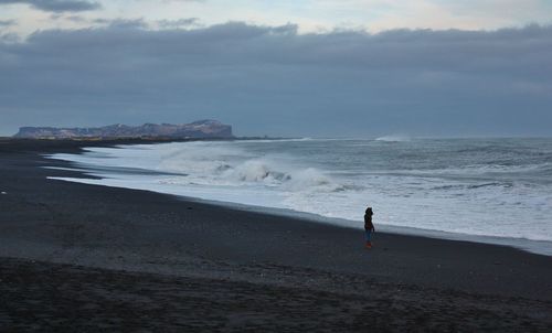 Scenic view of sea against cloudy sky