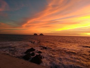 Scenic view of sea against sky during sunset