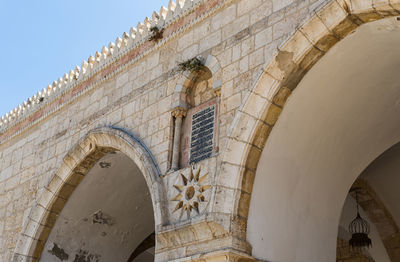 Low angle view of old building against sky