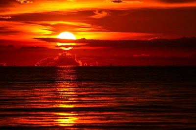Scenic view of sea against romantic sky at sunset