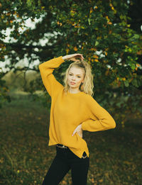 Young woman standing on field