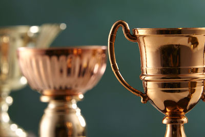 Close-up of trophy against green background