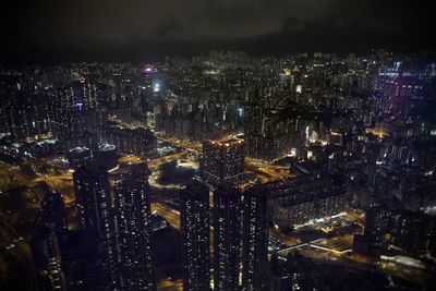 High angle view of illuminated modern buildings in city at night