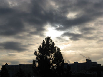 Low angle view of building against cloudy sky