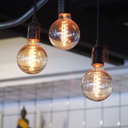Low angle view of illuminated light bulb