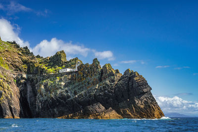 Skellig lighthouse on the edge of cliff, skellig michael island where star wars were filmed, ireland