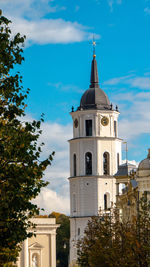 Church by building against sky