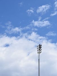 Low angle view of floodlight against sky