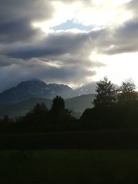 Scenic view of silhouette mountains against sky