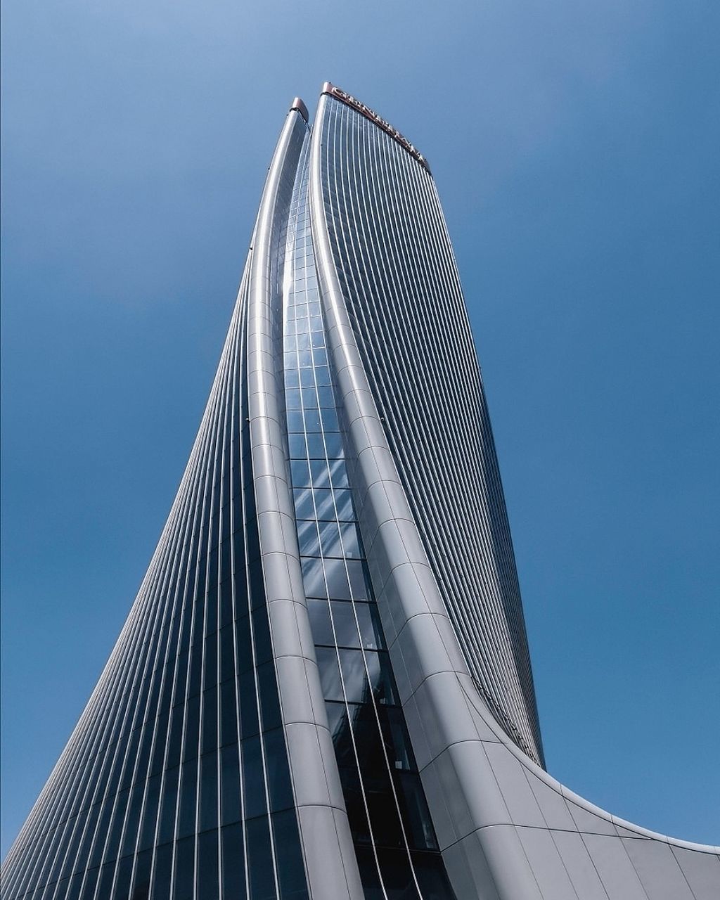 sky, architecture, low angle view, built structure, building exterior, clear sky, modern, office building exterior, no people, nature, city, day, skyscraper, tall - high, building, travel destinations, tower, sunlight, outdoors, luxury