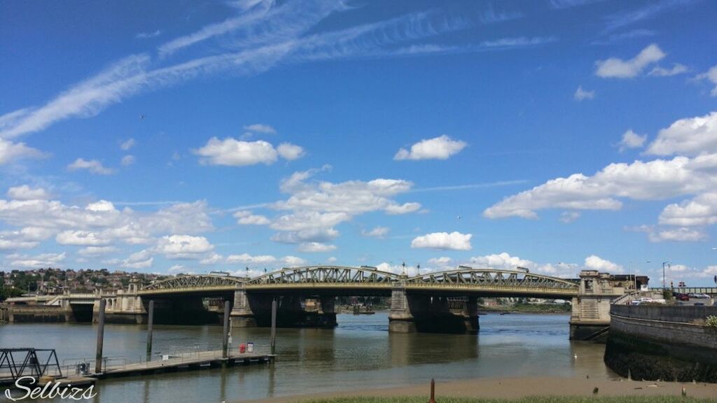 bridge - man made structure, architecture, connection, built structure, water, sky, river, bridge, transportation, engineering, waterfront, cloud - sky, cloud, blue, building exterior, railing, day, arch bridge, outdoors, no people