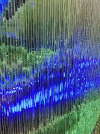 Close-up of illuminated glass lights on field