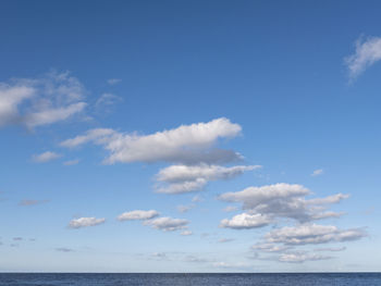 Scenic view of sea against blue sky