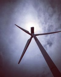 Low angle view of windmill against sky