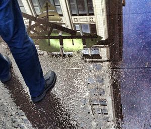 Low section of woman standing on tiled floor