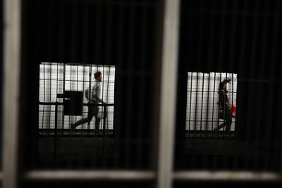 Men standing in corridor