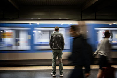 Blurred motion of train at railroad station