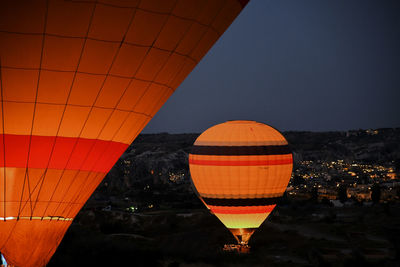 Low angle view of hot air balloons against sky