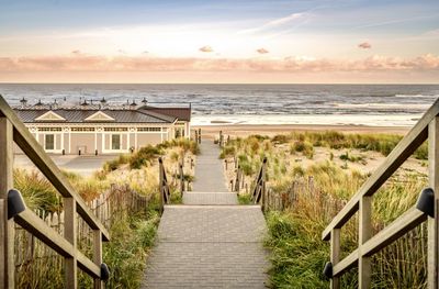 Scenic view of beach against sky during sunset