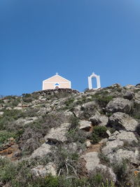View of rock formation against clear blue sky