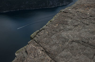 High angle view of rocks by sea