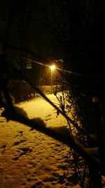 Close-up of illuminated shadow at night