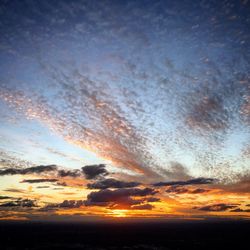 Low angle view of dramatic sky during sunset