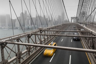 Brooklyn bridge misty weather yellow nyc cab taxi