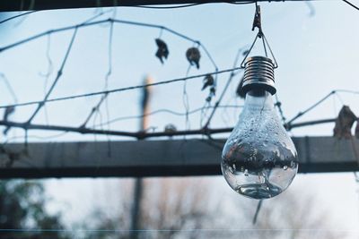 Low angle view of hanging against sky