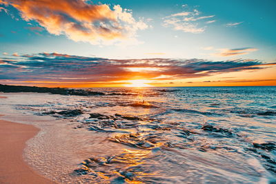 Scenic view of sea against sky during sunset