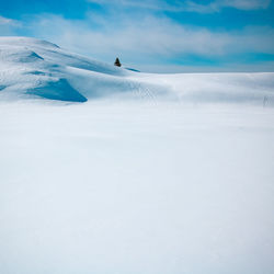 Scenic view of snow covered mountain against sky