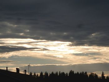 Silhouette of landscape against cloudy sky