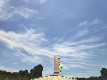 Low angle view of cross against sky