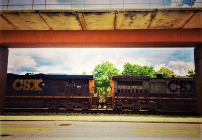 Train at railroad station against sky