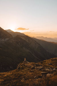 Scenic view of mountains against sky during sunset