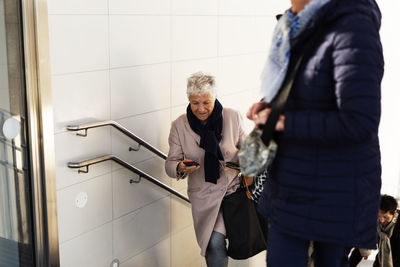 Senior woman on staircase