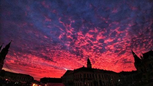 Silhouette of historic building against sky at sunset