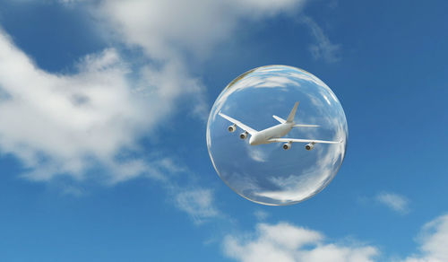 Low angle view of bubbles against sky