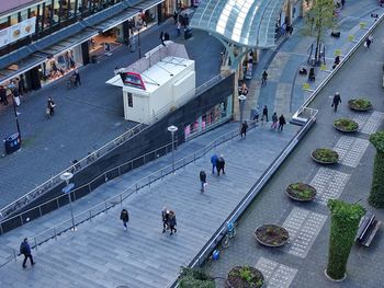 High angle view of people walking on street in city