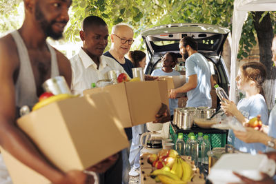 Rear view of people in market