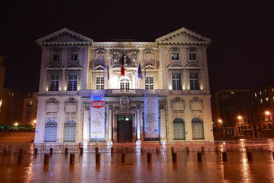 Facade of historical building at night