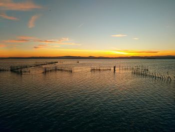 Scenic view of sea against sky during sunset