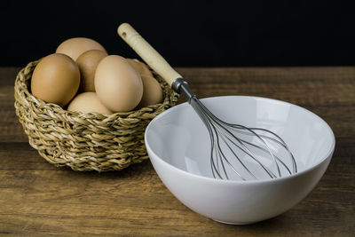 Close-up of eggs in basket on table