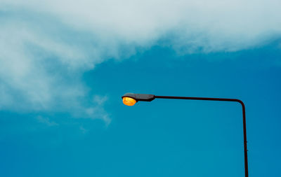 Low angle view of street light against sky