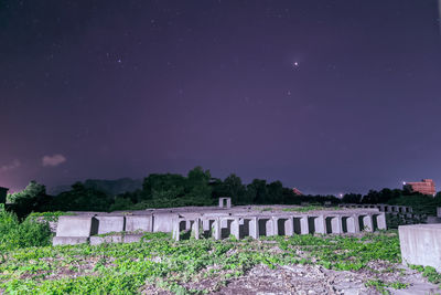 Scenic view of bridge against sky at night