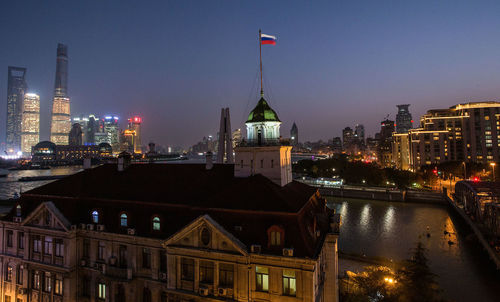 Illuminated buildings in city at night