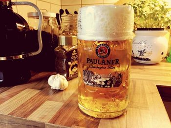 Close-up of beer glass on table