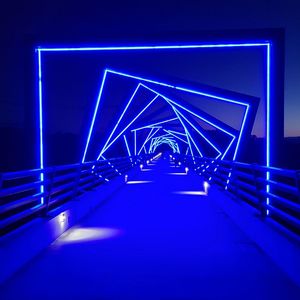 Illuminated footbridge at night