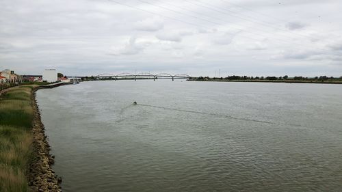 Bridge over river against sky